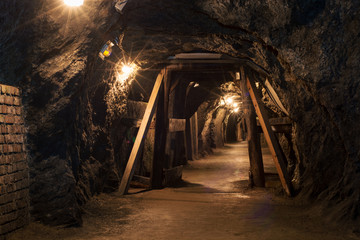 Long tunnel through gypsum mine - obrazy, fototapety, plakaty