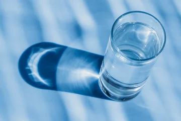  Glass of water on a blue background © fotogray71