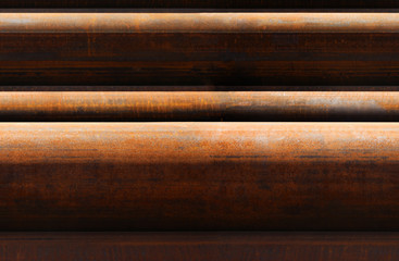 horizontal seamless pattern of rusty pipes
