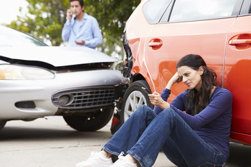Female Driver Making Phone Call After Traffic Accident