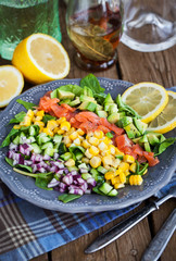Salmon, avocado, corn, cucumber and onion salad