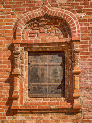 Fragment of a brick wall with a window