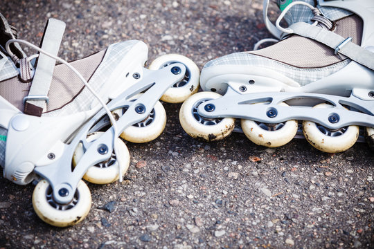 Closeup Roller Skates On Asphalt.