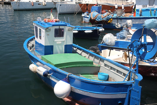 Small fishing boat in the harbor of Pozzuoli