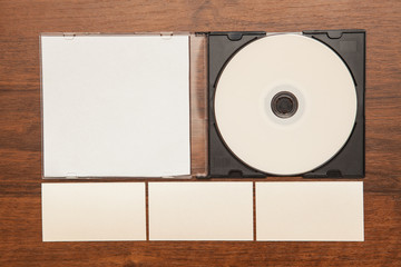 DVD ROM business cards and flash card on a wooden background. 