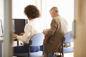 Obraz premium Mature Students Working In College Breakout Area