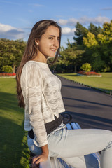 Beautiful teen on a bench