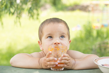 a little boy, two years old, smiling, summer, naked to the waist