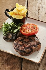 rib eye steak plated meal