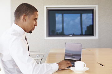 Businessman Having Video Conference In Boardroom