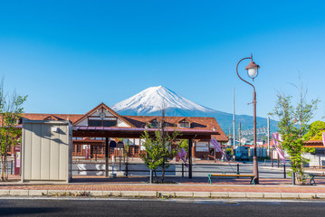 Naklejka premium kawaguchiko bus stop with Mount Fuji behide Kawaguchiko station