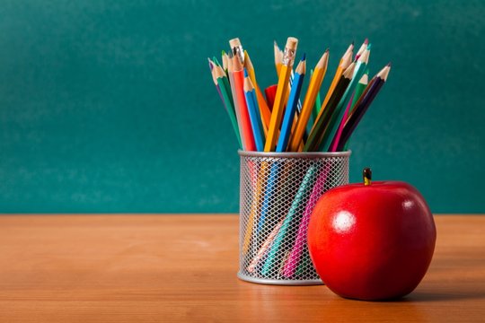 Teacher, desk, apple.