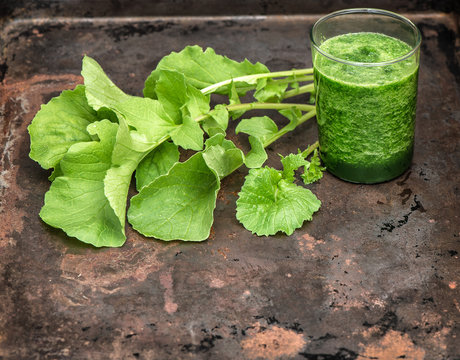 Healthy smoothy of fresh green radish leaves. Vegan food. Detox