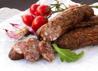 Smoked sausages with greens, cherry tomatoes 