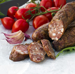 Smoked sausages with greens, cherry tomatoes 