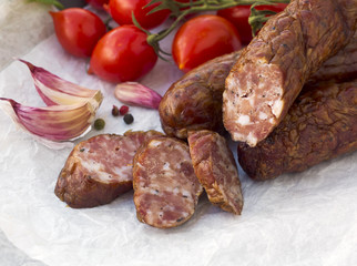 Smoked sausages with greens, cherry tomatoes 