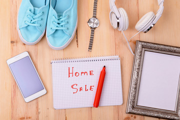 Sale unwanted stuff on wooden background top view