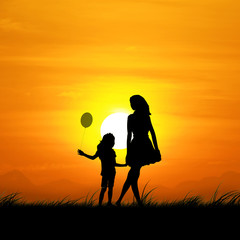 Fototapeta na wymiar Silhouette of the girl and the mother in the beautiful sunset.