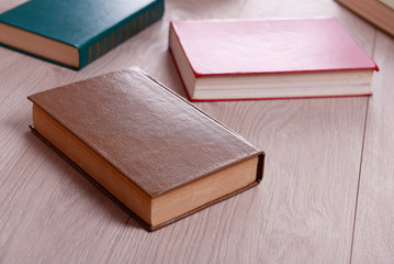 Heap of books on wooden background