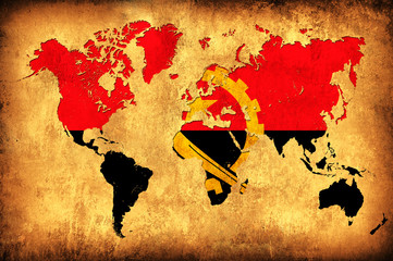 The flag of Angola in the outline of the world map