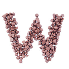 Alphabet from chocolate chips on white background