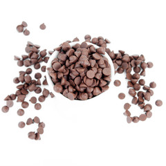 chocolate chips in white cup on white background