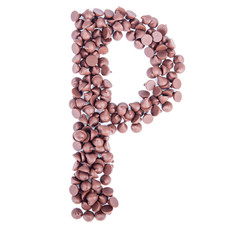 Alphabet from chocolate chips on white background