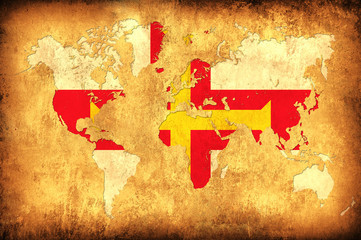 The flag of Guernsey in the outline of the world map