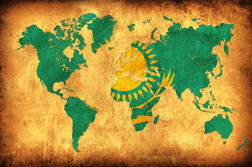 The flag of Kazakhstan in the outline of the world map