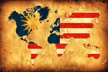 The flag of Malaysia in the outline of the world map