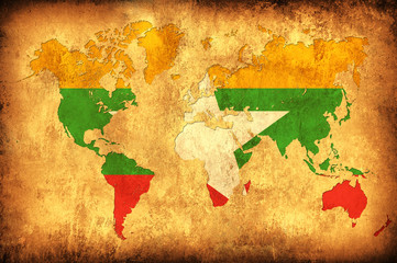 The flag of Myanmar in the outline of the world map