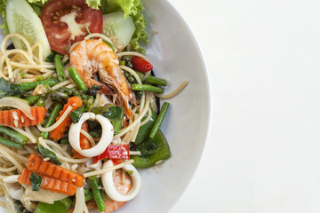 Thai style fried spaghetti with spicy seafood, food background