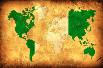 The flag of Nigeria in the outline of the world map