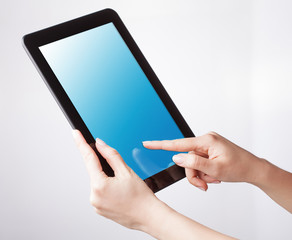 tablet pc with a blank screen in the hands. Business, technology