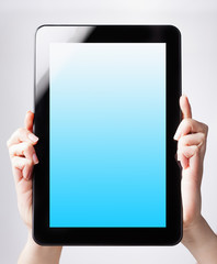 tablet pc with a blank screen in the hands. Business, technology