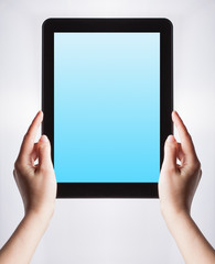 tablet pc with a blank screen in the hands. Business, technology