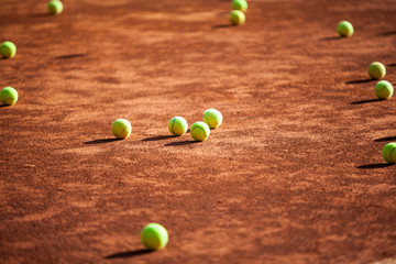 Tennis balls on the clay court.