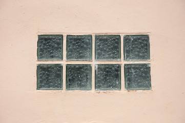 old glass windows on the orange wall
