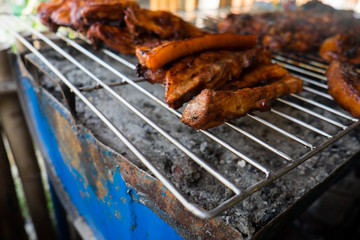 Roast chicken leg on grill