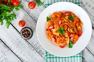 Fettuccine pasta with shrimp, tomatoes and herbs
