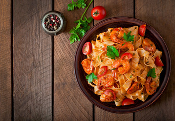 Fettuccine pasta with shrimp, tomatoes and herbs