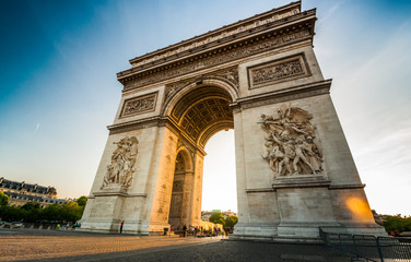 Fototapeta na wymiar Triumphal Arch at the end of Champs-Elysees street before sunset