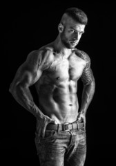 Fototapeta na wymiar Muscular man - half-length, black and white photo