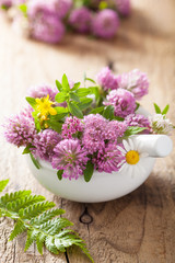 Fototapeta na wymiar colorful medical flowers and herbs in mortar