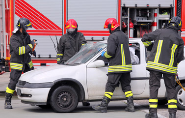 firemen in action after the traffic accident