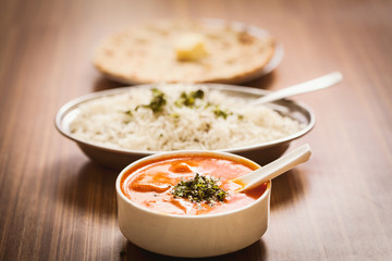 Close up of a delicious food  Butter Paneer,  steamed rice, chapati