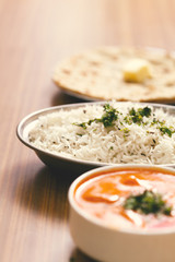 Close up of a delicious food  Butter Paneer,  steamed rice, chapati