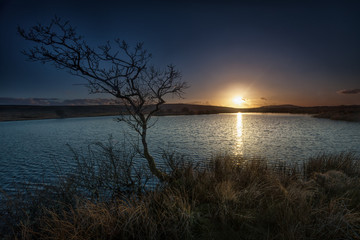 Fototapeta na wymiar Broad Pool North Gower Underneath the hills of Cefn Bryn, Broadpool is ideal for the setting sun.