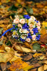 bouquet of roses on autumn leaves