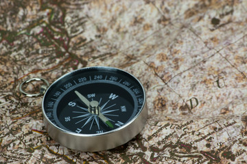 Fototapeta na wymiar Finding Your Direction - Compass and Map